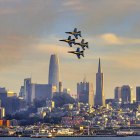 The Blue Angels dramatically fly over downtown San Francisco during Fleet Week.